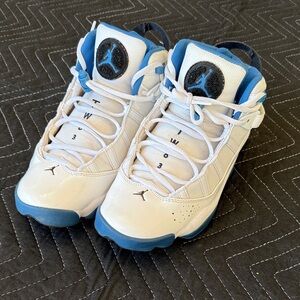 This is a pair of Jordan 6 Rings in a white and blue colorway